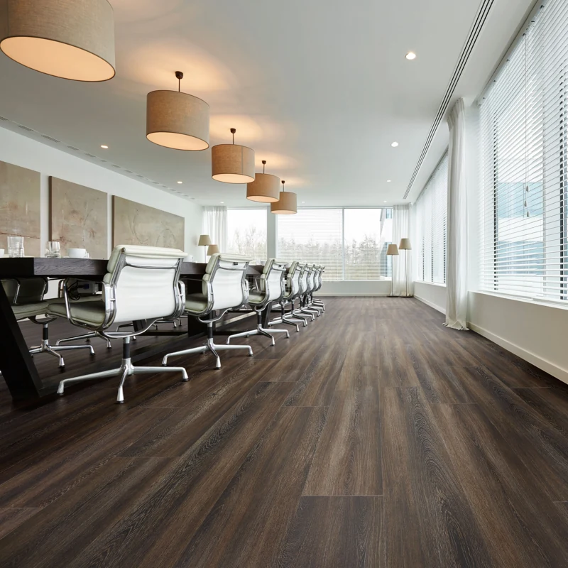 Deep brown wood flooring in large office boardroom