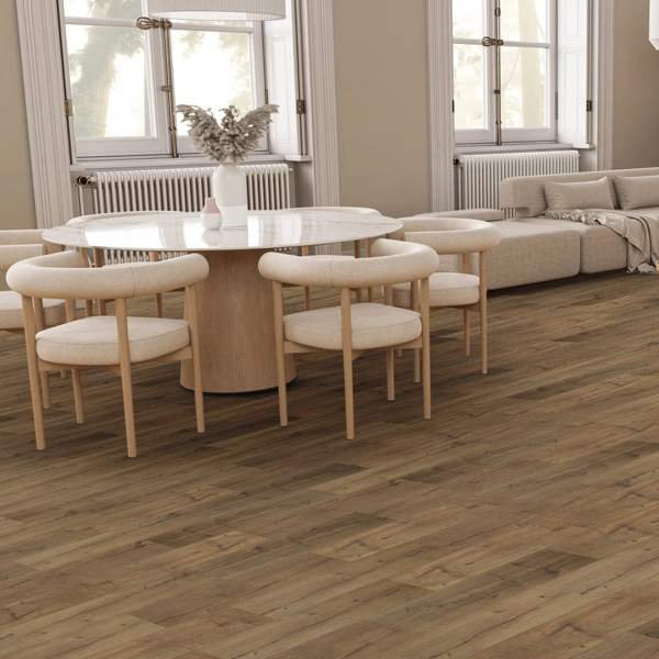 Modern dining room with wood floors and round marble table.