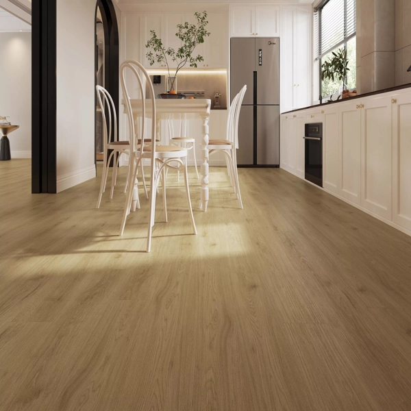 Modern kitchen with light wood floors and white furniture.