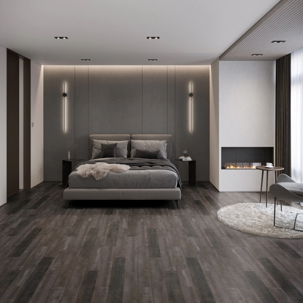 Modern minimalist bedroom with dark wood floors and fireplace.